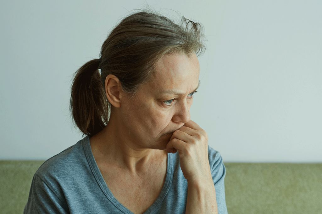 A woman experiences anxiety with maladaptive coping skills.